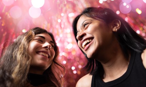 Two female students smiling