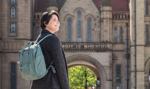 Female student in front of archway